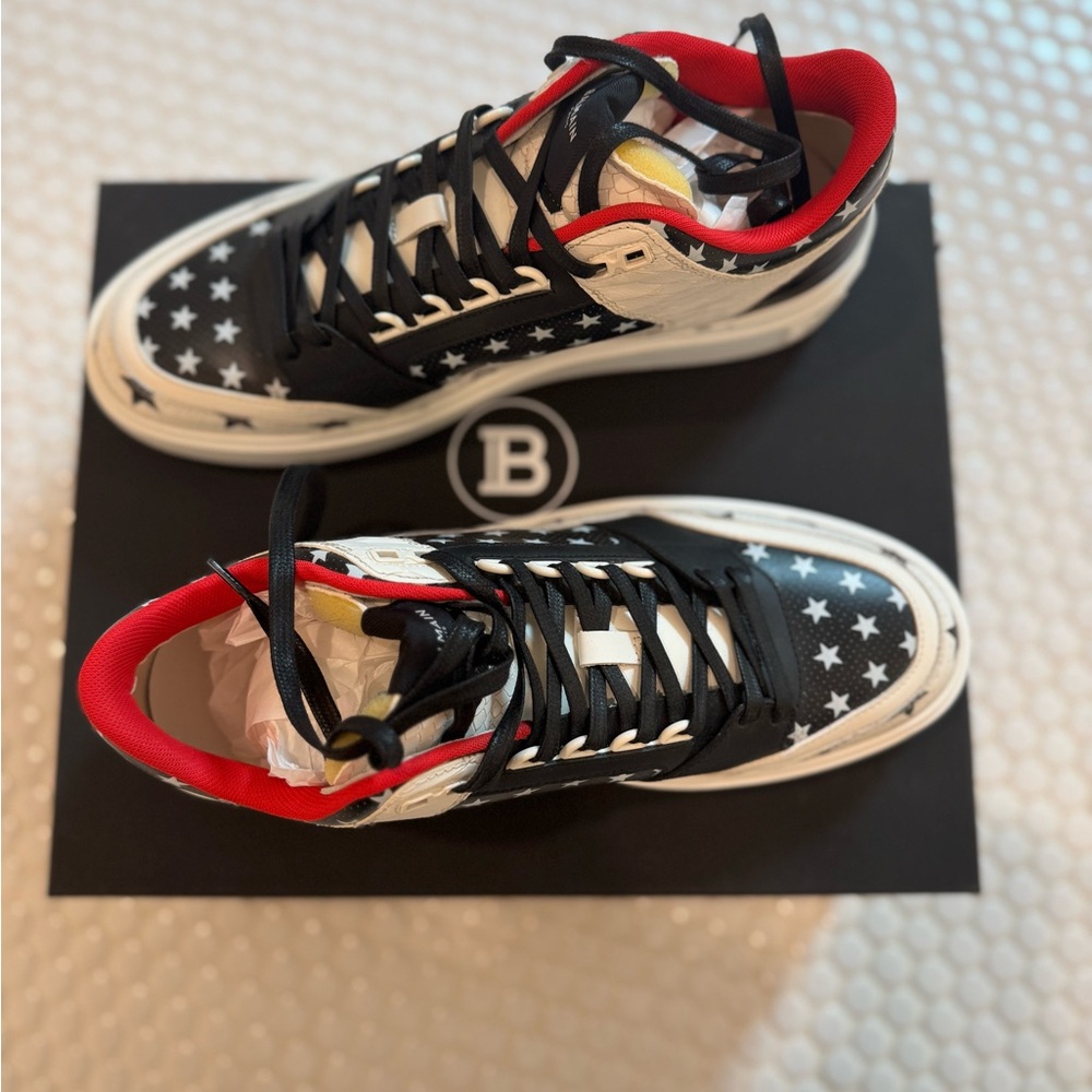 BALMAIN
Black & White B-Court Mid Top Star Sneakers
